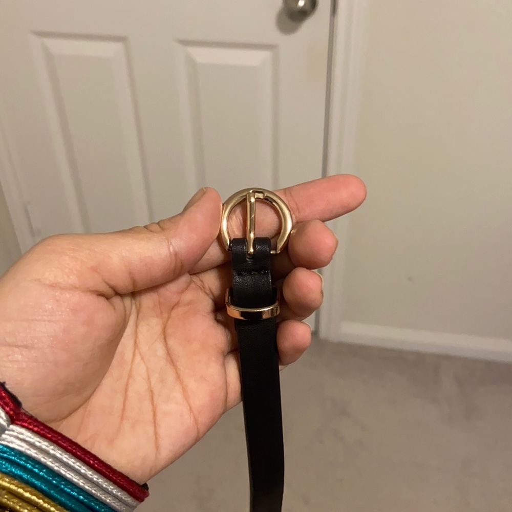 Skinny black belt with gold buckle